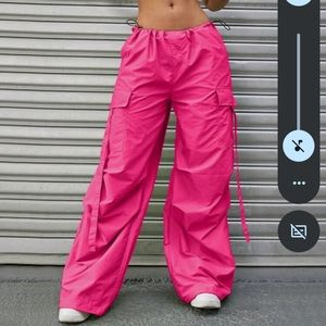 Hot pink cargo parachute pants Y2K style